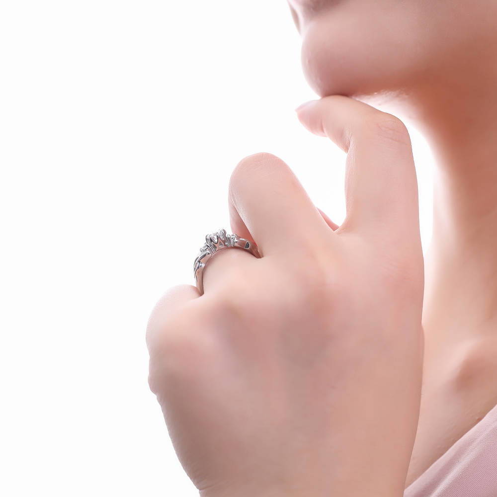 Model wearing 3-Stone Celtic Knot 0.8ct CZ Ring in Sterling Silver, 7 of 9