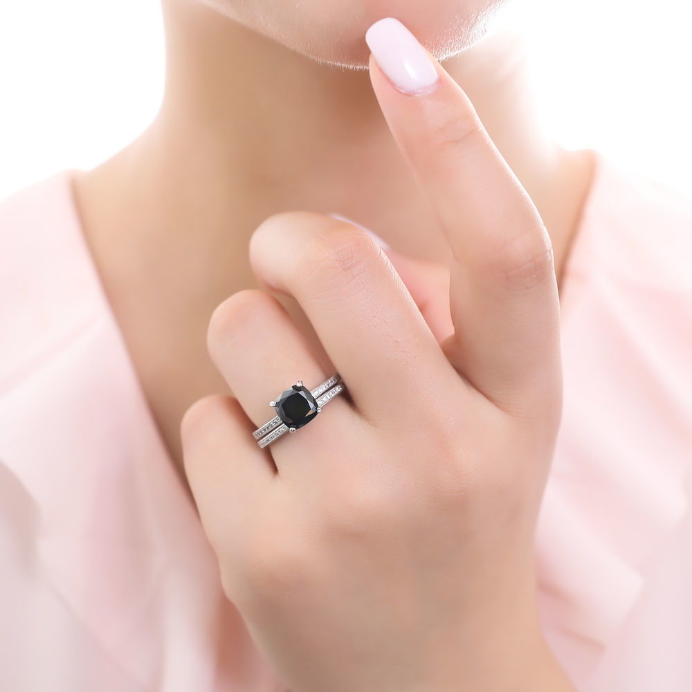 Model wearing Solitaire 3ct Black Cushion CZ Ring Set in Sterling Silver, 2 of 9