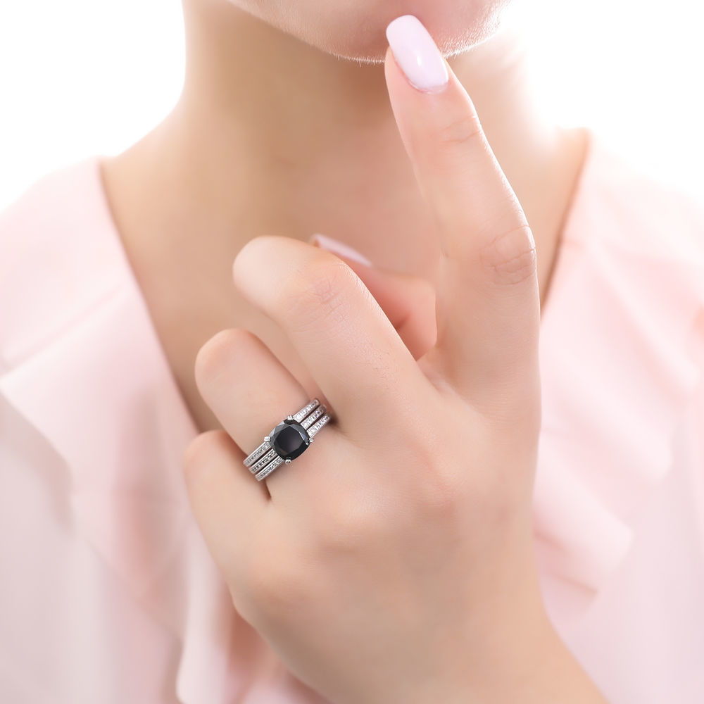Model wearing Solitaire 3ct Black Cushion CZ Ring Set in Sterling Silver, 2 of 9