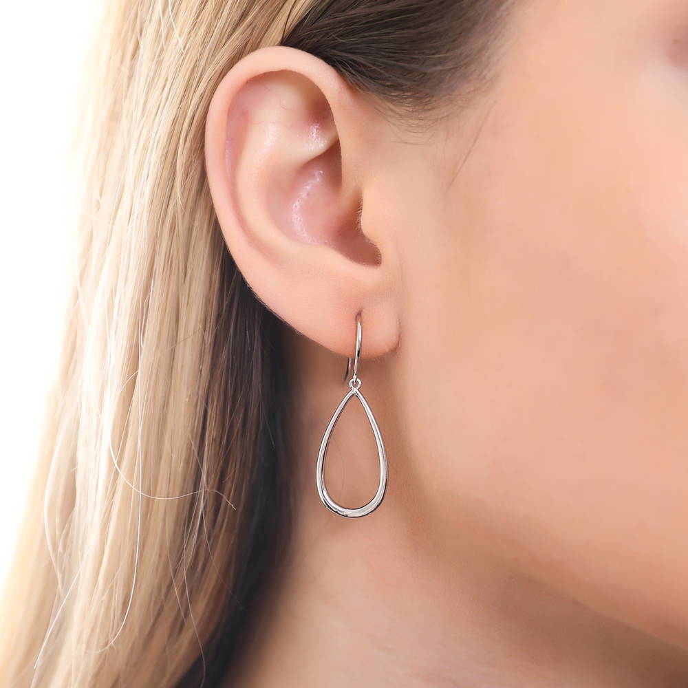 Model wearing Teardrop Fish Hook Earrings in Sterling Silver, 2 of 5
