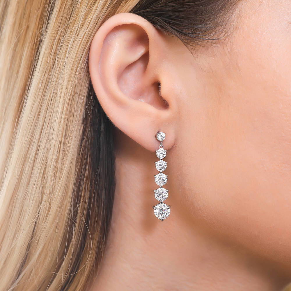 Model wearing Graduated CZ Earrings in Sterling Silver, 2 of 8