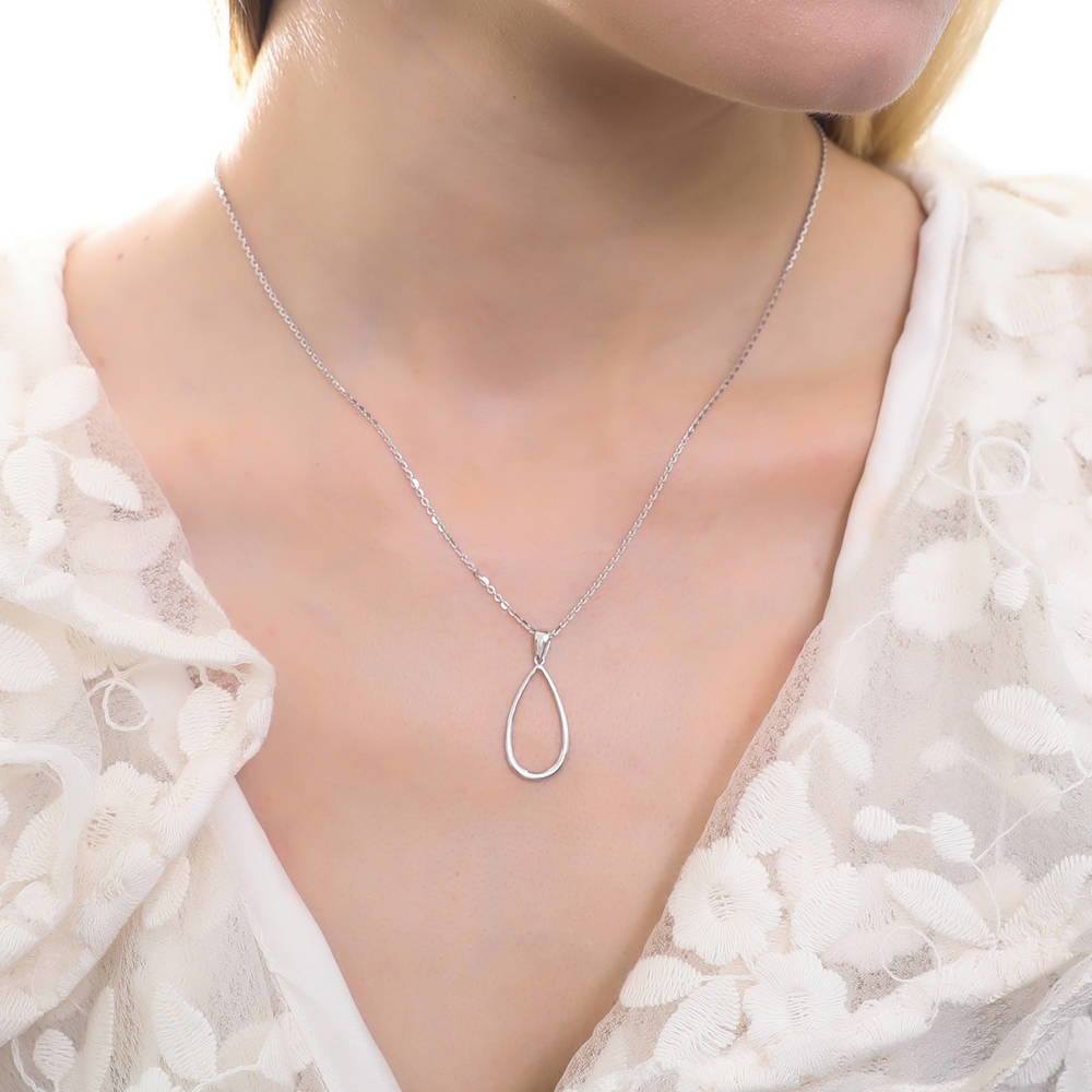 Model wearing Teardrop Necklace and Earrings in Sterling Silver, 7 of 11