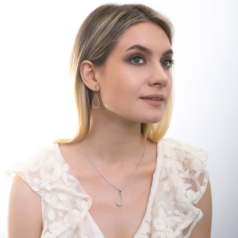 Model wearing Teardrop Fish Hook Earrings in Sterling Silver, 4 of 5