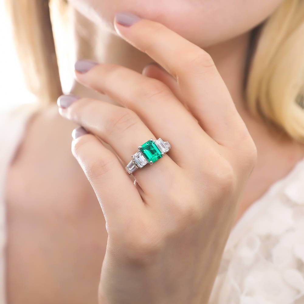 Model wearing 3-Stone Emerald-Green Emerald Cut CZ Ring in Sterling Silver, 2 of 7