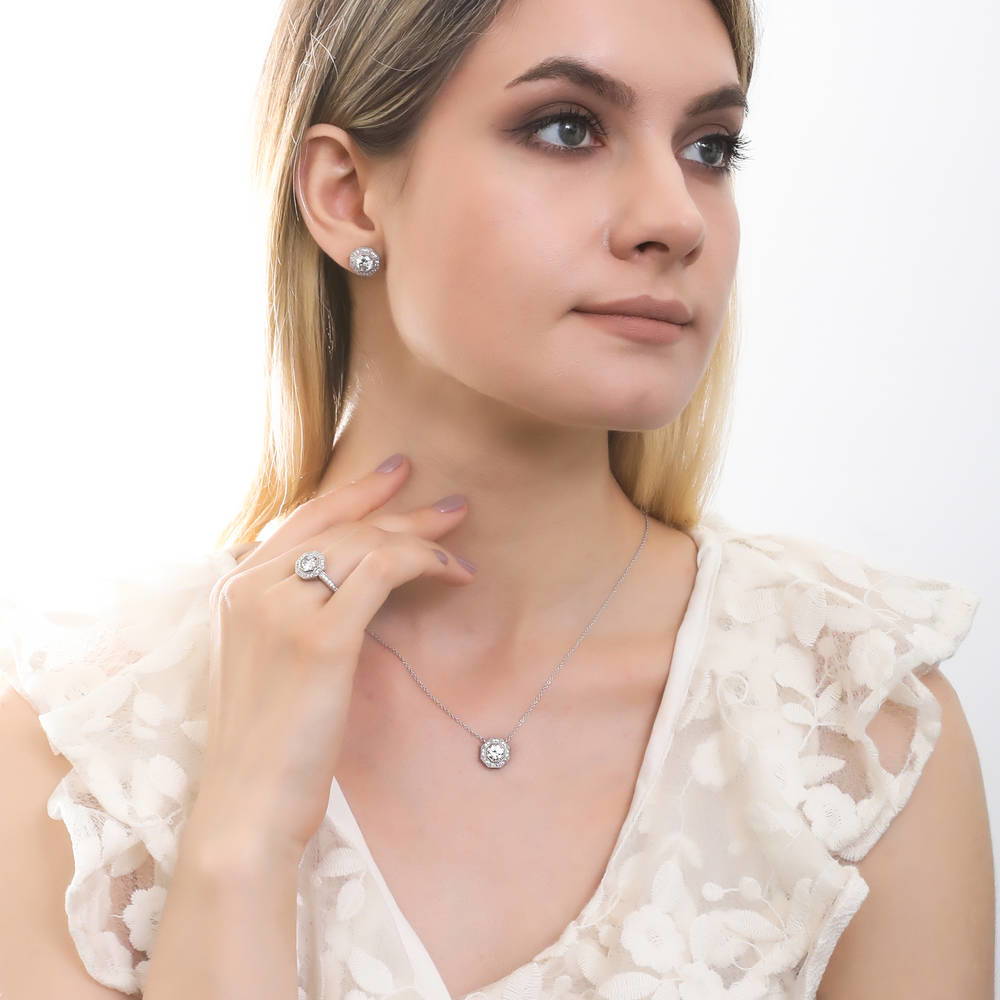 Model wearing Halo Milgrain Octagon Sun Cut CZ Stud Earrings in Sterling Silver, 3 of 5