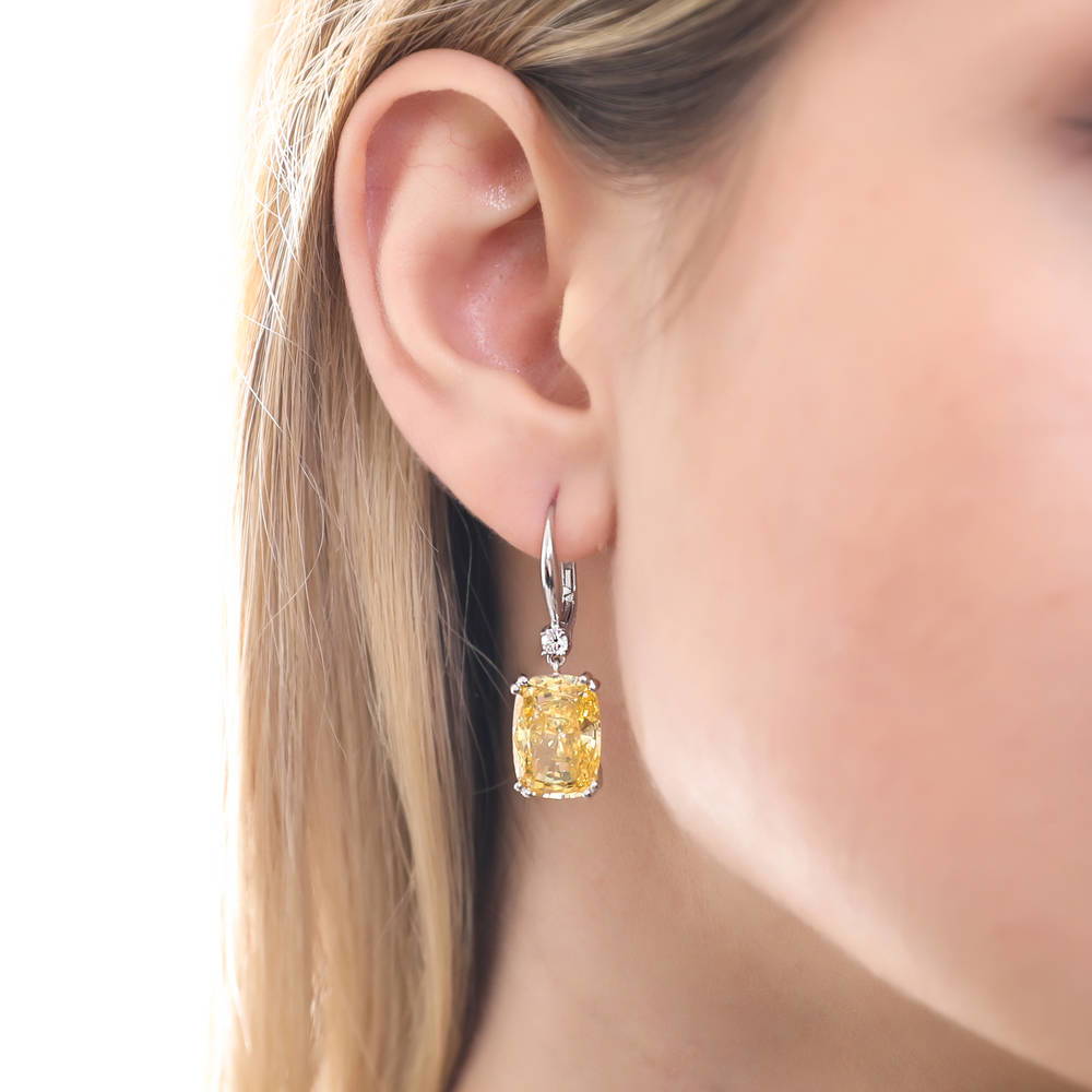 Model wearing Solitaire Canary Yellow CZ Leverback Earrings in Sterling Silver, 2 of 6