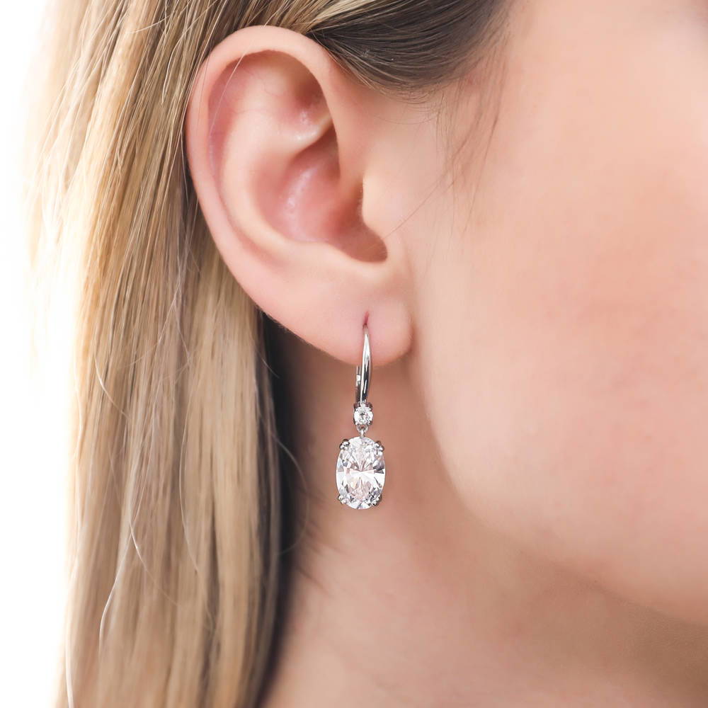 Model wearing Solitaire 6ct Oval CZ Leverback Earrings in Sterling Silver, 2 of 3