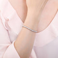 Model wearing Round CZ Tennis Bracelet, Rhodium Plated / 6.5 inch