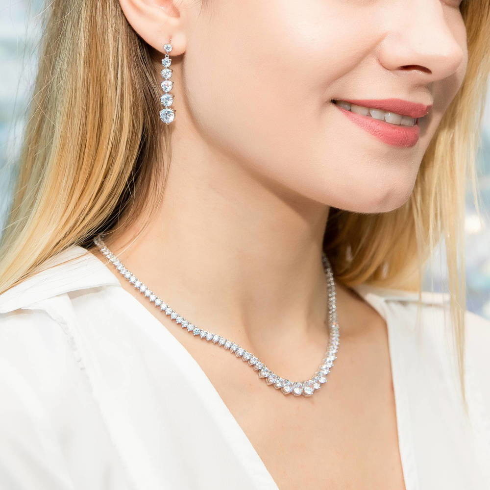 Model wearing Graduated CZ Earrings in Sterling Silver, 6 of 8