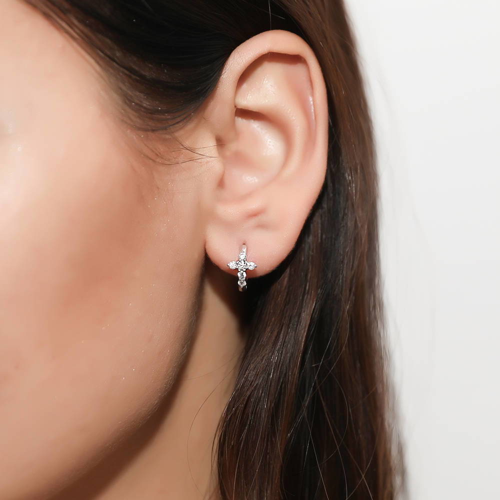 Model wearing Cross CZ Mini Huggie Earrings in Sterling Silver 0.5 inch, Yellow Gold Flashed
