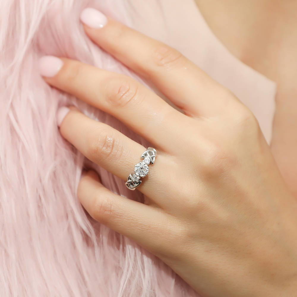 Model wearing 3-Stone Celtic Knot 0.8ct CZ Ring in Sterling Silver, 2 of 9