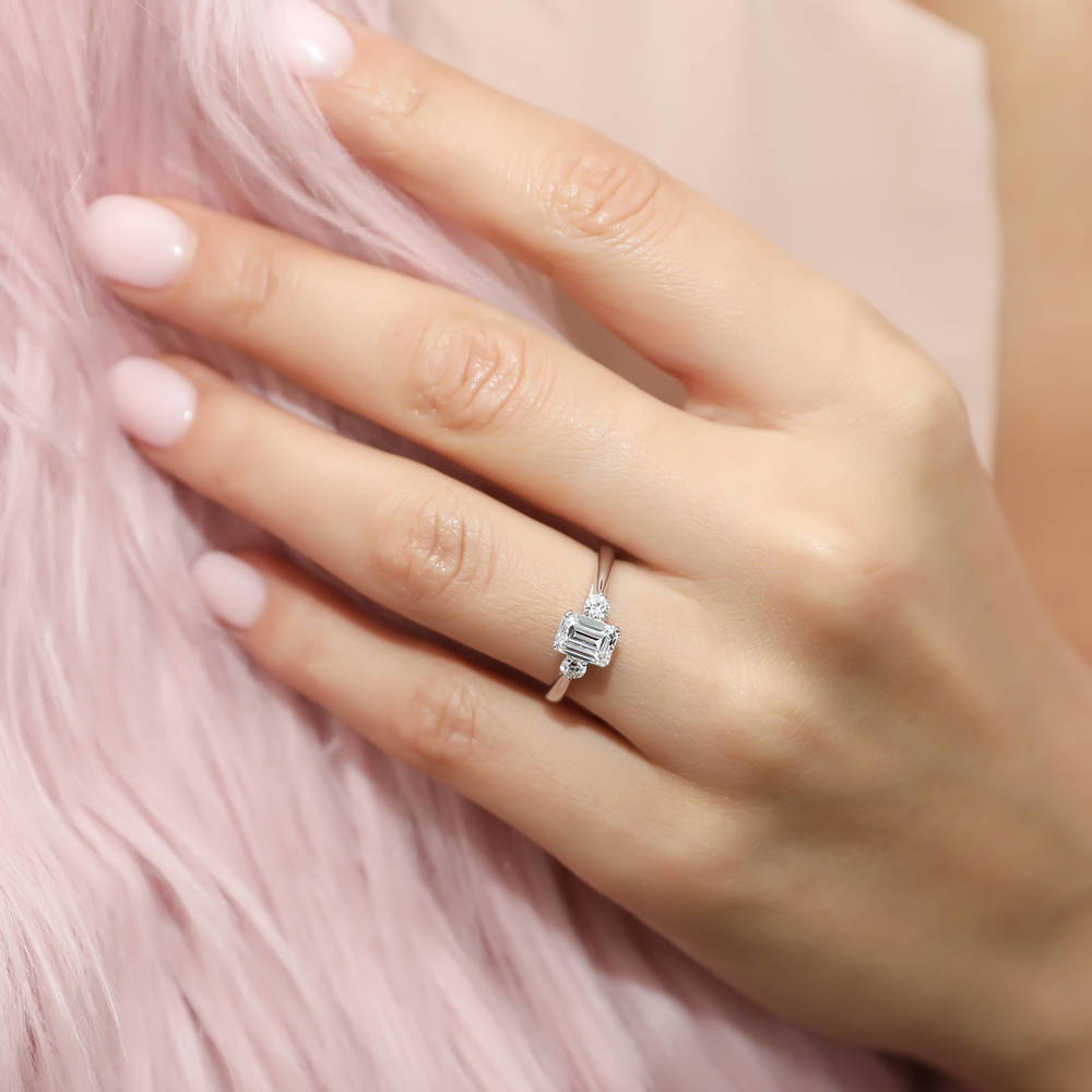 Model wearing 3-Stone 1ct Emerald Cut CZ Ring Set in Sterling Silver, 11 of 12