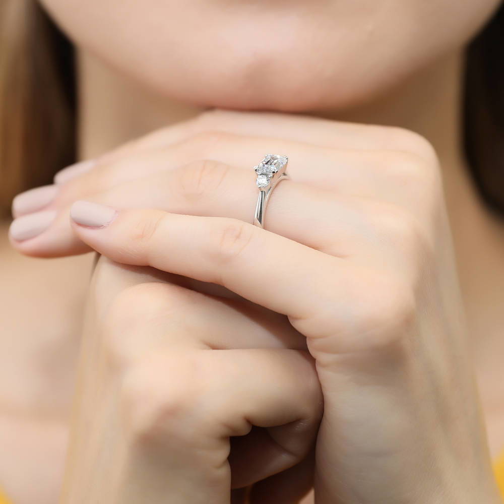 Model wearing 3-Stone East-West 1ct Emerald Cut CZ Ring Set in Sterling Silver, 11 of 12