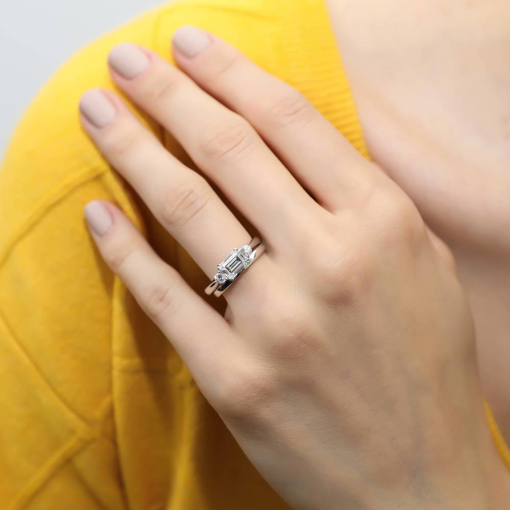 Model wearing 3-Stone East-West 1ct Emerald Cut CZ Ring Set in Sterling Silver, 2 of 12