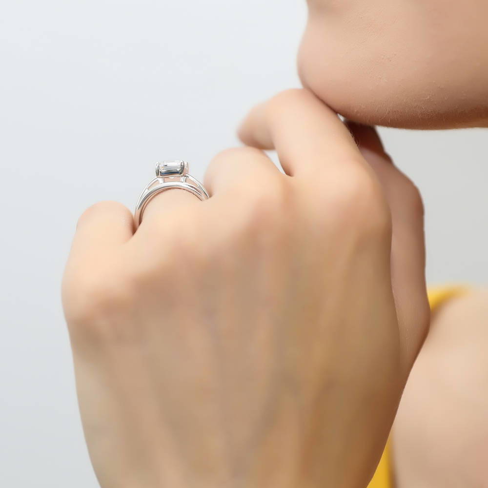 Model wearing Solitaire 2.1ct Emerald Cut CZ Ring Set in Sterling Silver, 9 of 13