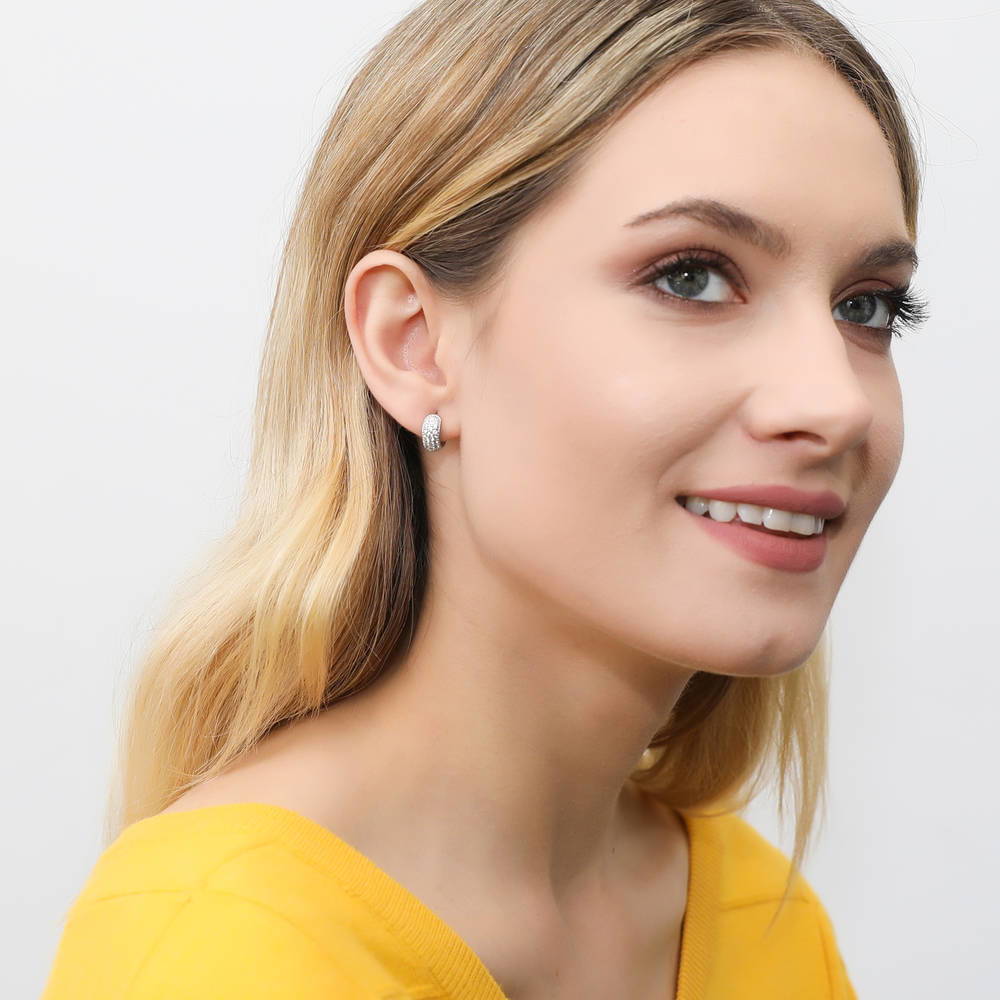 Model wearing Dome CZ Huggie Earrings in Gold Flashed Sterling Silver, 2 Pairs, 3 of 11