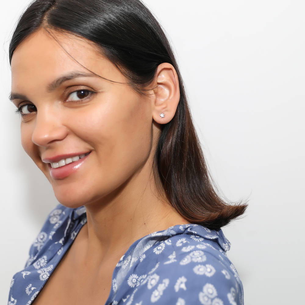 Model wearing Star Cartilage Stud Earrings in Sterling Silver, 2 of 8