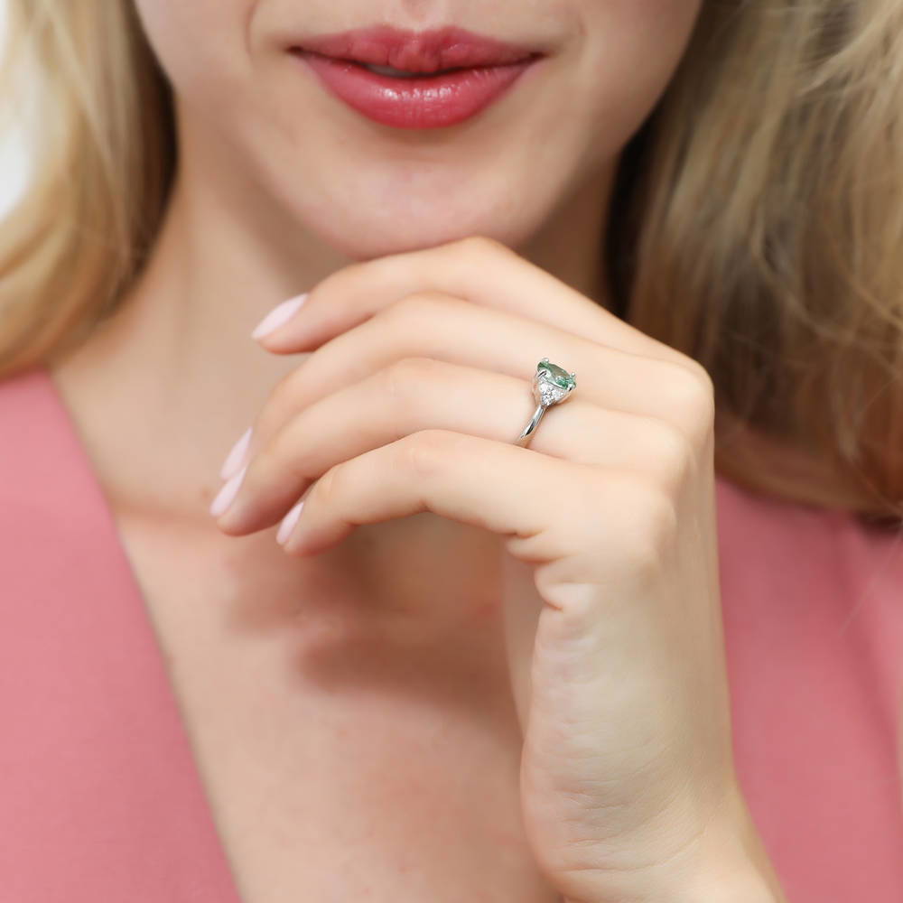 Model wearing Solitaire 1.2ct Green Oval CZ Ring in Sterling Silver, 6 of 7
