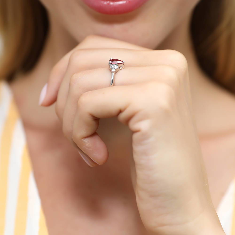 Model wearing Solitaire 0.8ct Red Pear CZ Ring in Sterling Silver, 6 of 7