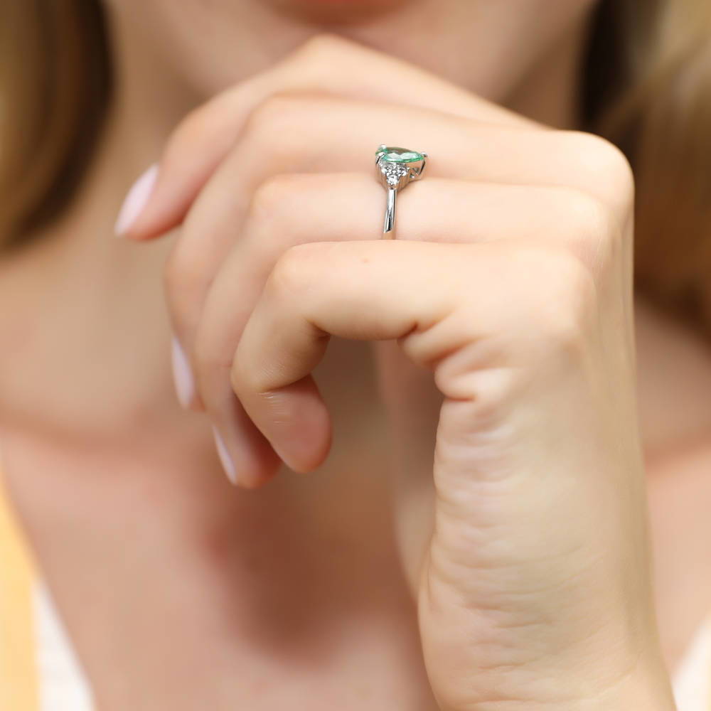 Model wearing Solitaire 0.8ct Green Pear CZ Ring in Sterling Silver, 6 of 7