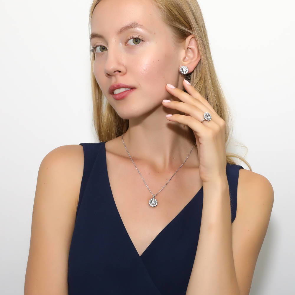Model wearing Flower Halo CZ Omega Back Stud Earrings in Sterling Silver, 5 of 5