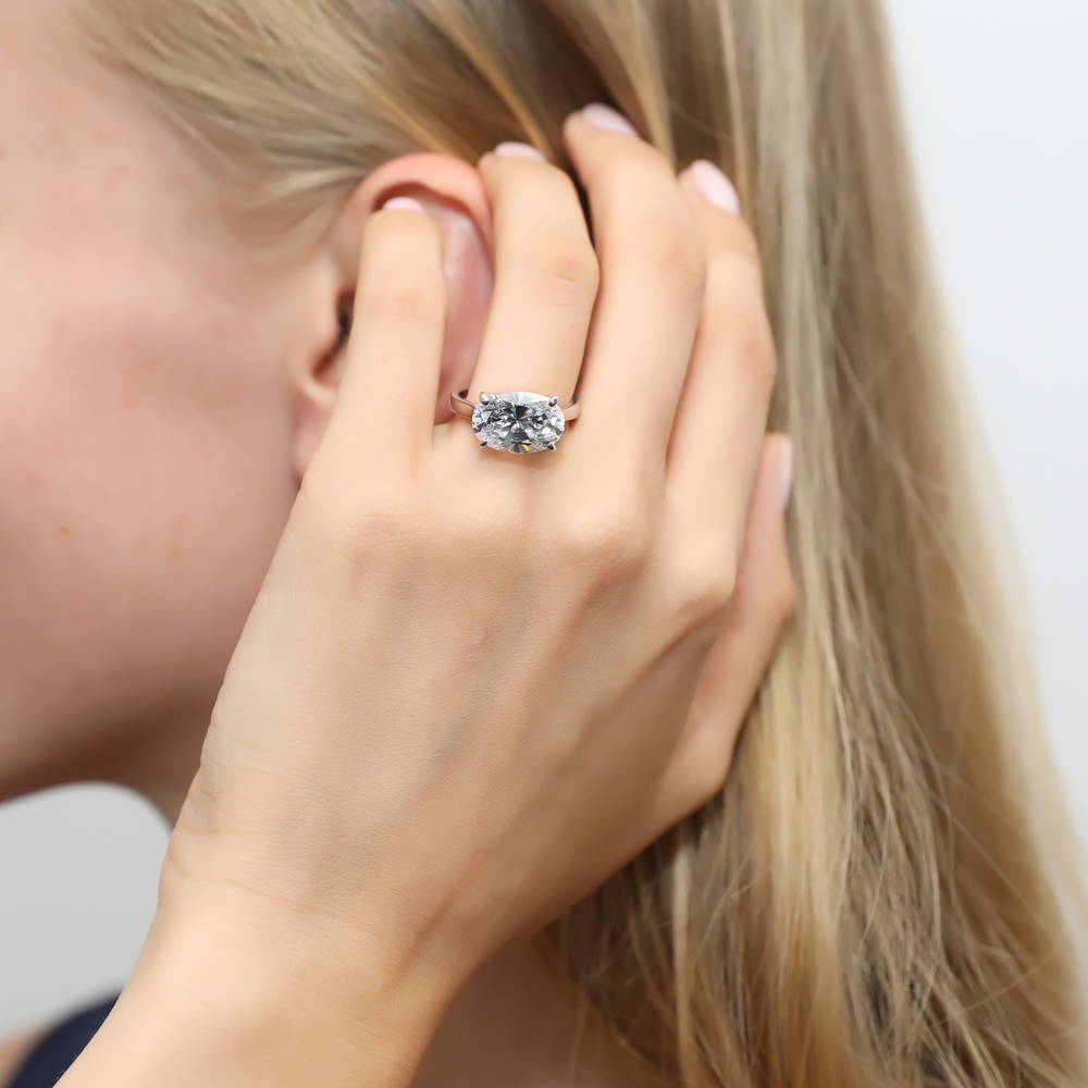 Model wearing Solitaire East-West 5.5ct Oval CZ Ring Set in Sterling Silver, 7 of 11