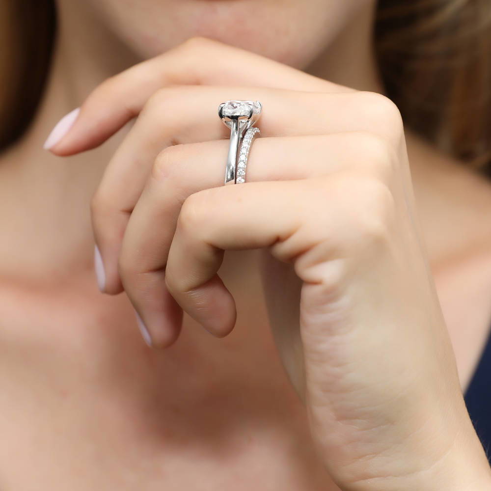 Model wearing Solitaire East-West 5.5ct Oval CZ Ring Set in Sterling Silver, 9 of 13