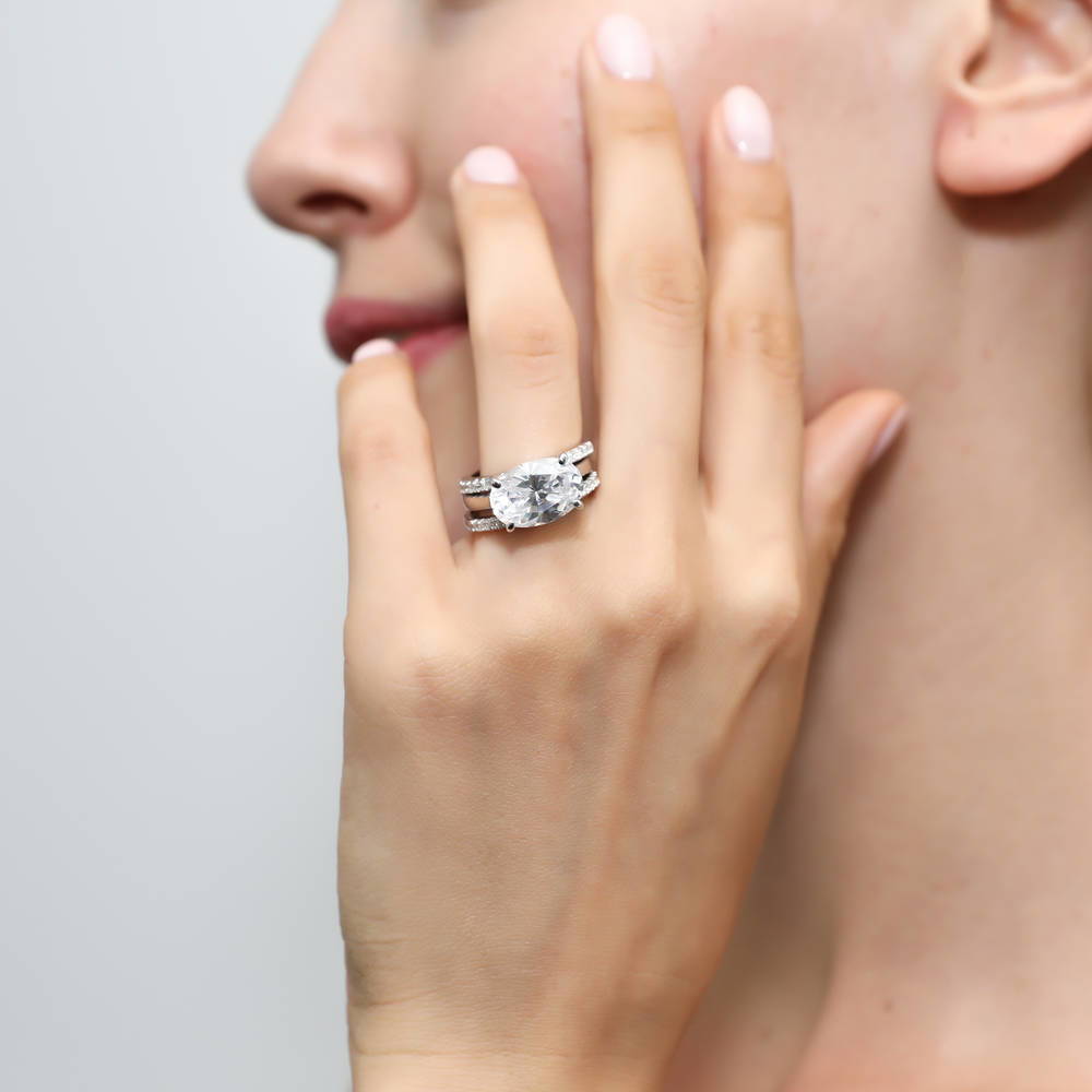 Model wearing Solitaire East-West 5.5ct Oval CZ Ring Set in Sterling Silver, 2 of 11