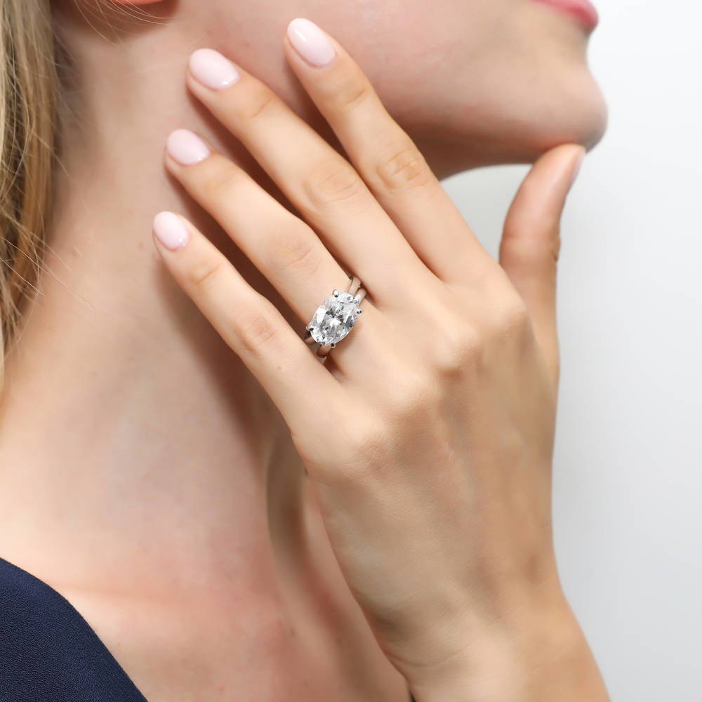 Model wearing Solitaire East-West 5.5ct Oval CZ Ring Set in Sterling Silver, 2 of 11