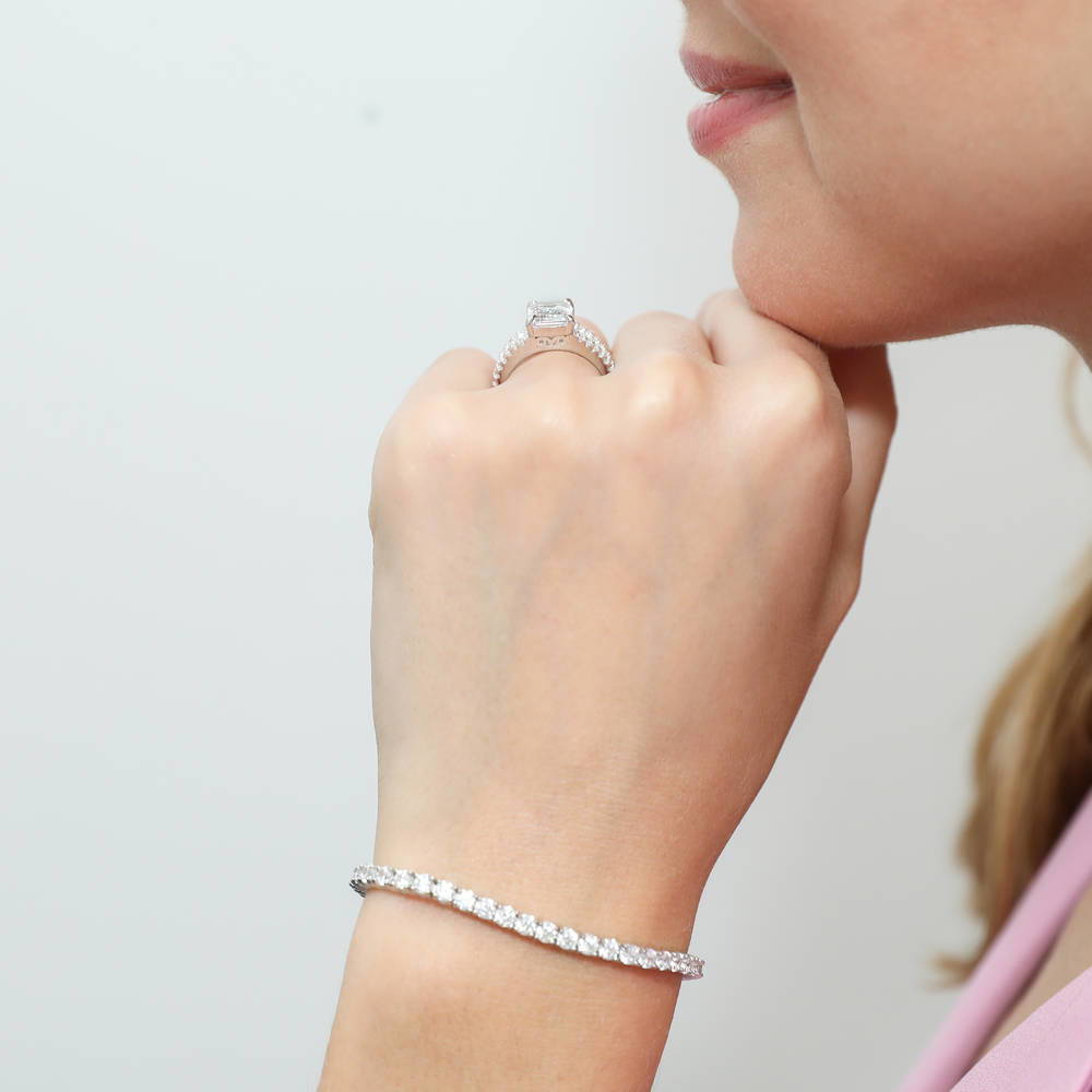 Model wearing Solitaire Emerald Cut CZ Split Shank Ring in Sterling Silver, 2 of 8