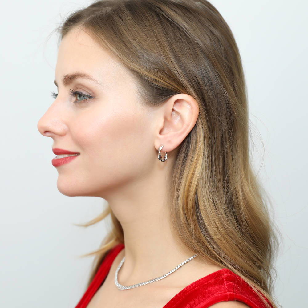 Model wearing Woven Small Hoop Earrings in Sterling Silver 0.6 inch, 3 of 7