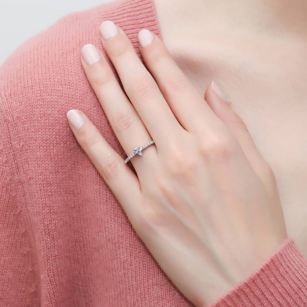 Model wearing Solitaire 0.3ct Pear CZ Ring in Sterling Silver, 3 of 10