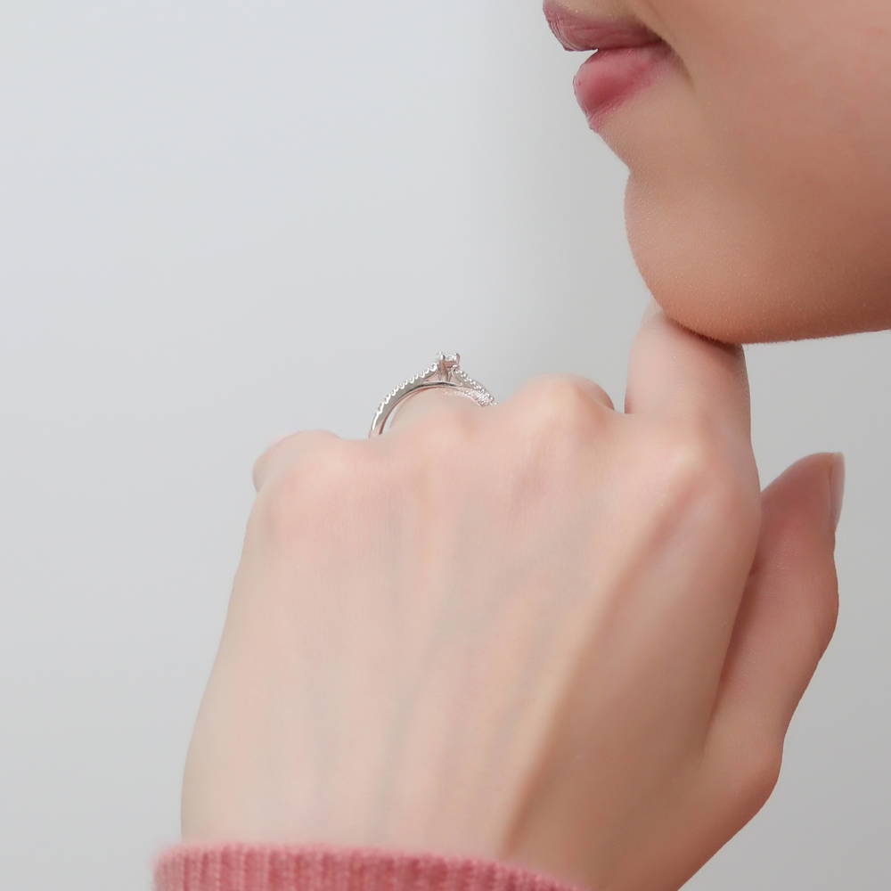 Model wearing Solitaire 0.3ct Pear CZ Ring in Sterling Silver, 9 of 10