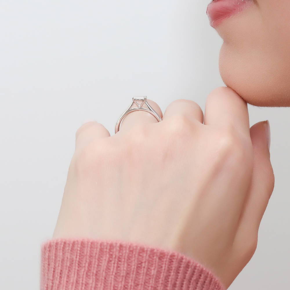 Model wearing Solitaire East-West 0.3ct Emerald Cut CZ Ring in Sterling Silver, 3 of 6
