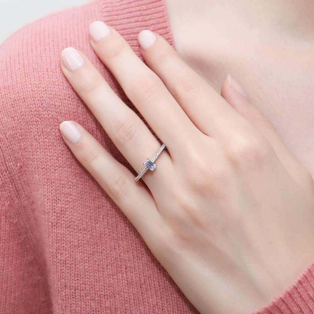 Model wearing Solitaire 0.3ct Emerald Cut CZ Ring in Sterling Silver, 2 of 8