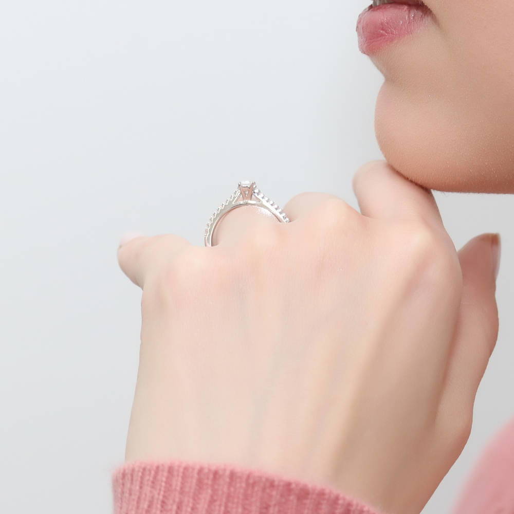 Model wearing Solitaire 0.3ct Emerald Cut CZ Ring in Sterling Silver, 3 of 8