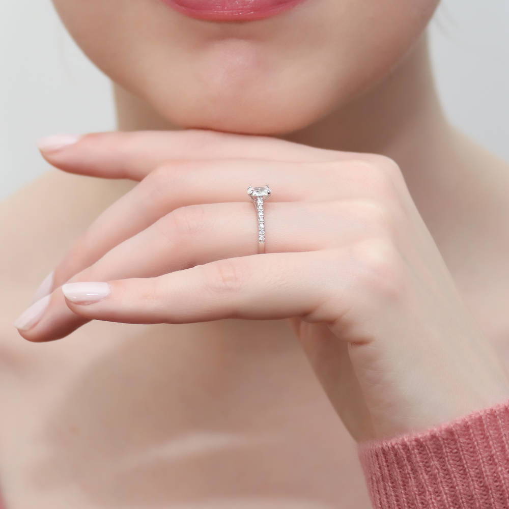 Model wearing Solitaire 0.4ct Oval CZ Ring in Sterling Silver, 6 of 8
