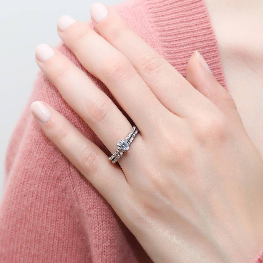 Model wearing Solitaire 0.4ct Oval CZ Ring in Sterling Silver, 9 of 11