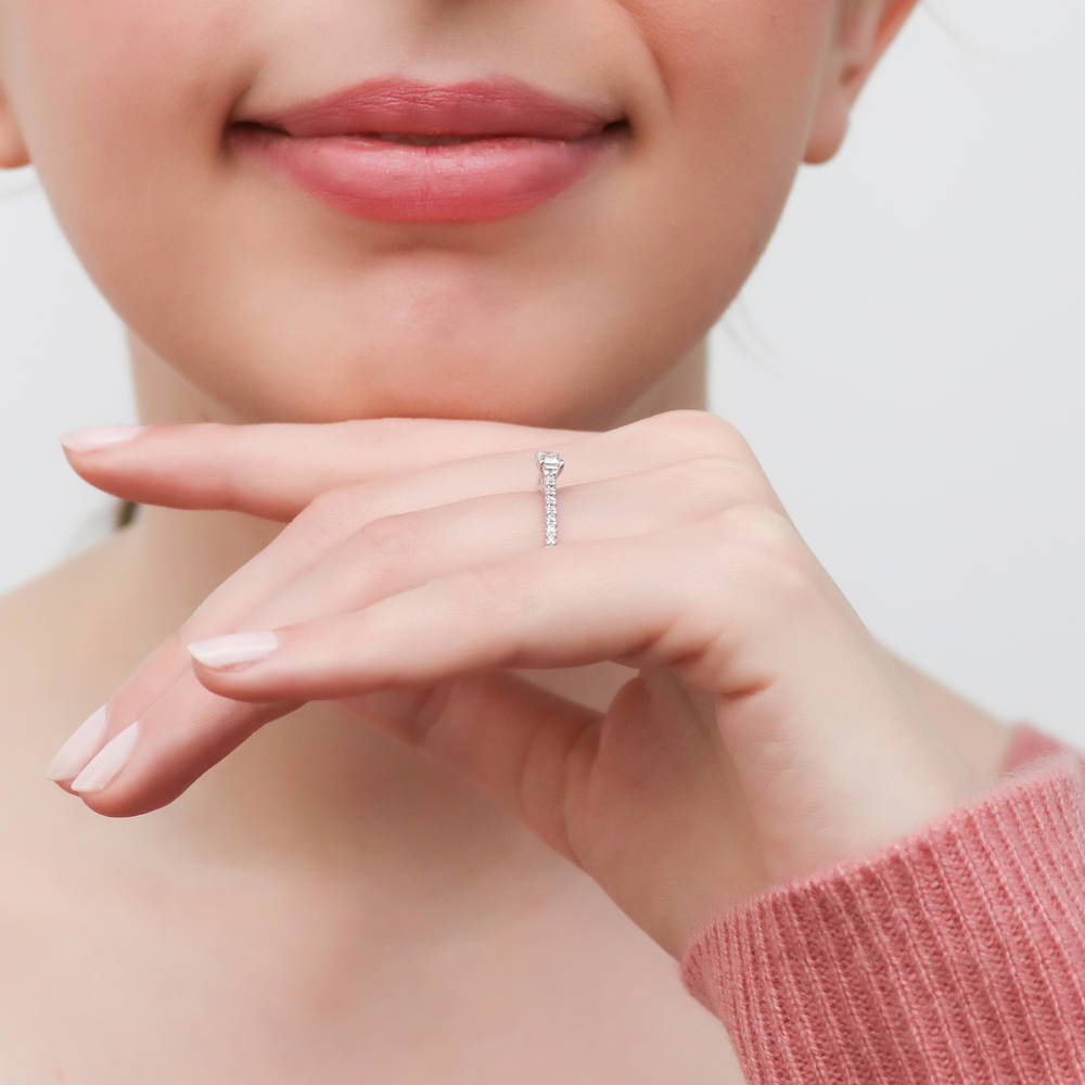 Model wearing Solitaire East-West 0.3ct Emerald Cut CZ Ring in Sterling Silver, 6 of 8