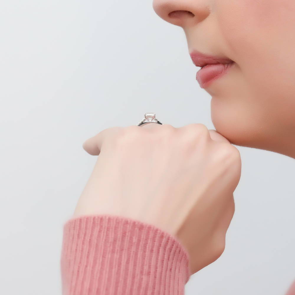 Model wearing Solitaire East-West 0.3ct Emerald Cut CZ Ring in Sterling Silver, 3 of 8
