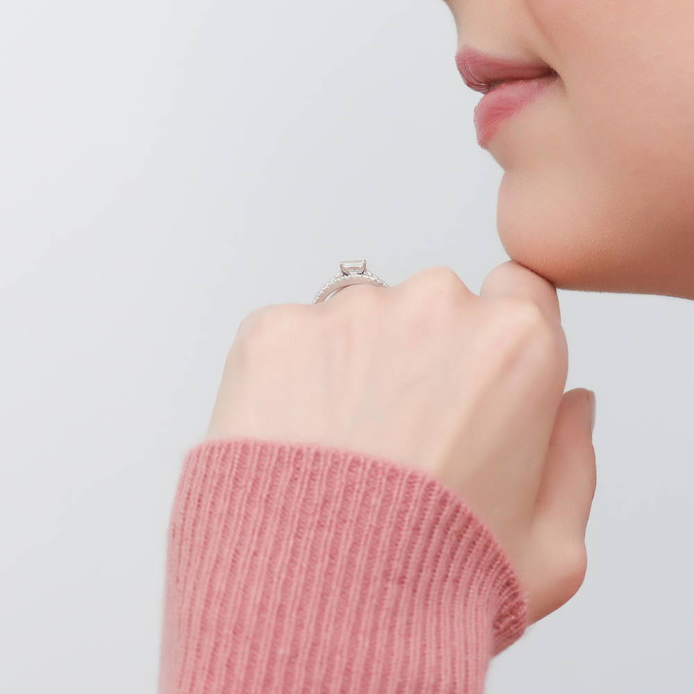 Model wearing Solitaire East-West 0.3ct Emerald Cut CZ Ring in Sterling Silver, 10 of 11