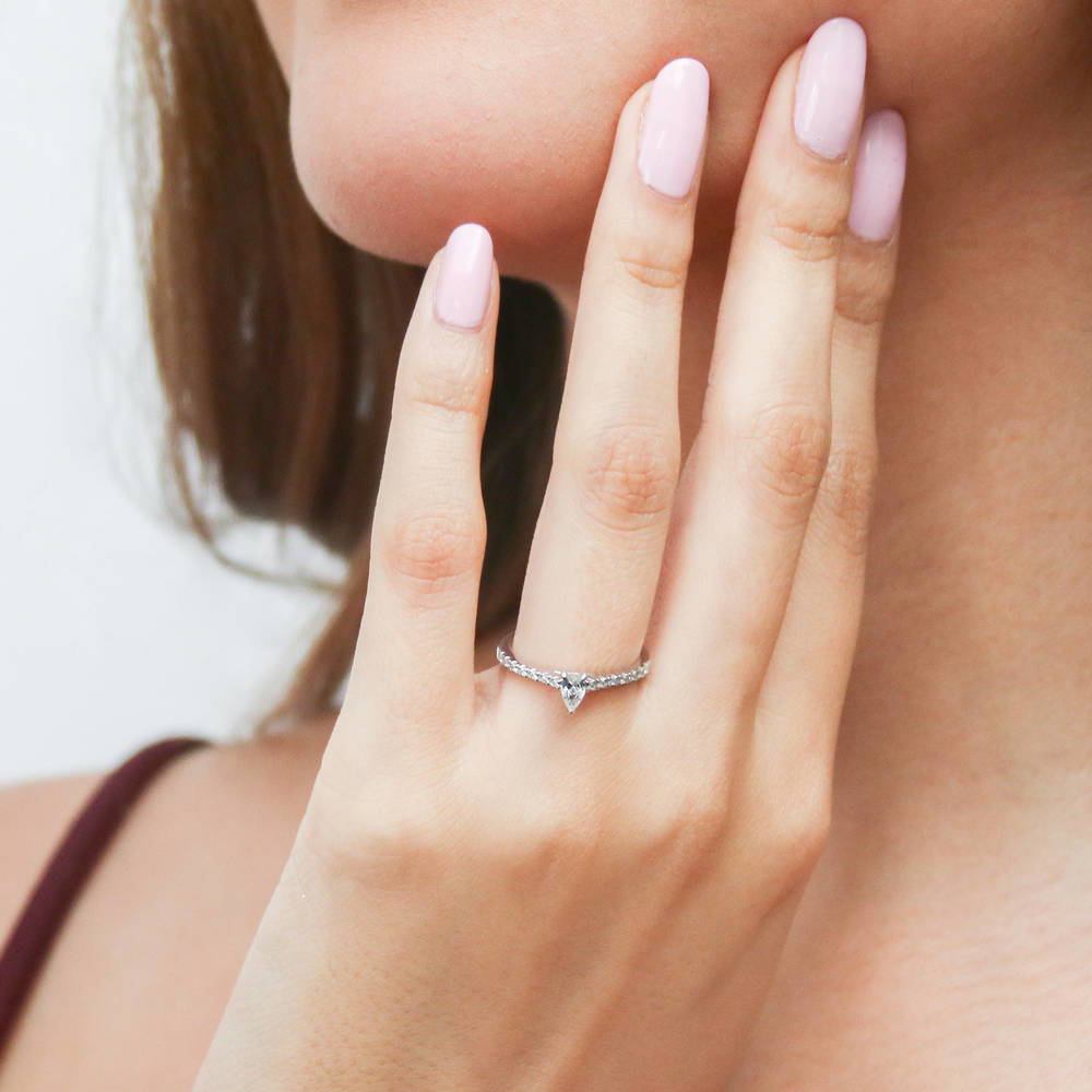 Model wearing Solitaire 0.3ct Pear CZ Ring in Sterling Silver, 2 of 10