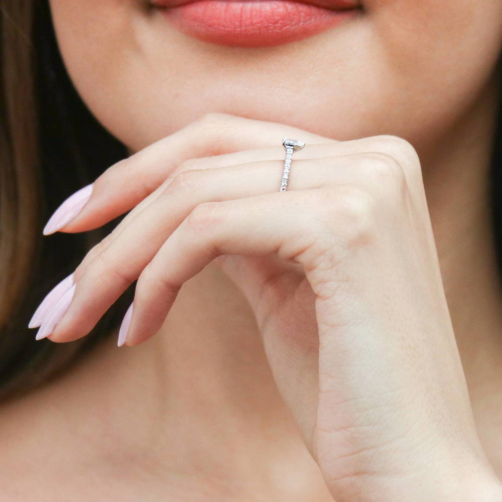 Model wearing Solitaire 0.3ct Pear CZ Ring in Sterling Silver, 7 of 10
