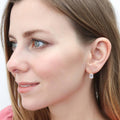 Model wearing Solitaire Emerald Cut CZ Leverback Earrings in Sterling Silver, Yellow Gold Flashed