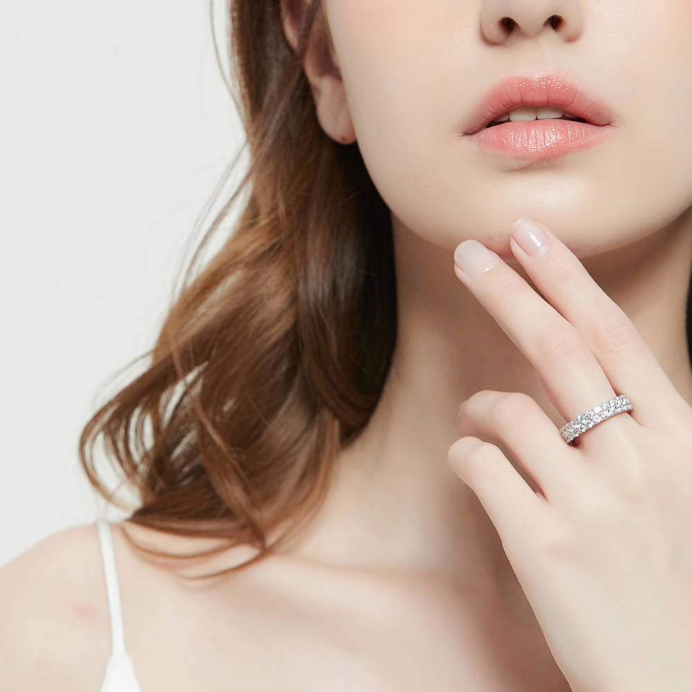 Model wearing Pave CZ Eternity Ring in Sterling Silver, 2 of 8