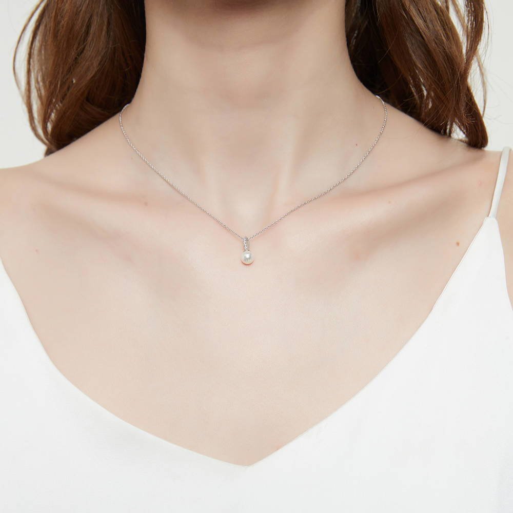 Model wearing Solitaire Imitation Pearl Necklace in Sterling Silver, 3 of 6