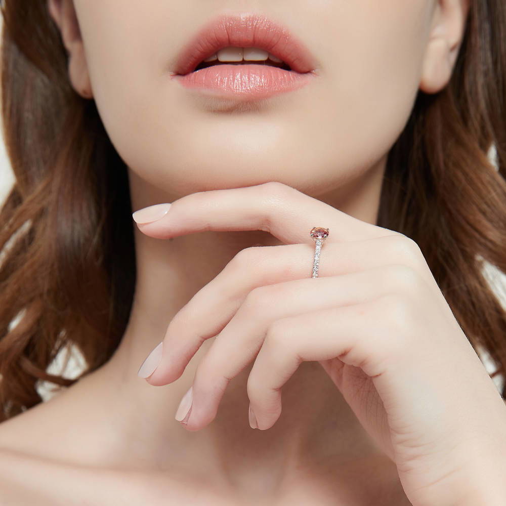 Model wearing Solitaire Kaleidoscope Red Orange CZ Ring in Sterling Silver, 6 of 7