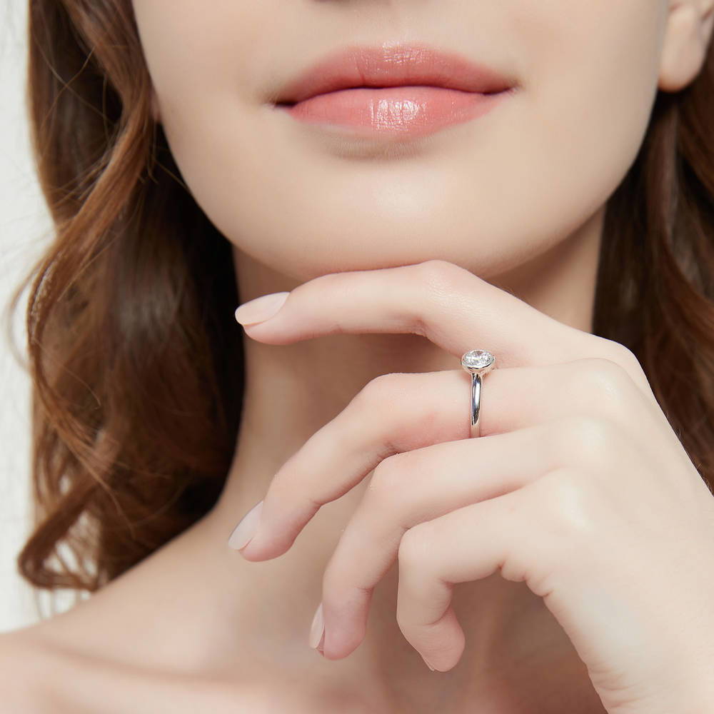 Model wearing Solitaire 0.8ct Bezel Set Round CZ Ring Set in Sterling Silver, 11 of 12