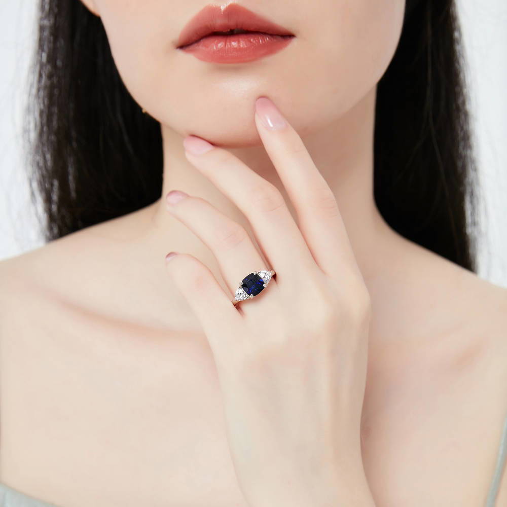 3-Stone Criss Cross Sapphire-Blue CZ Ring Set in Sterling Silver