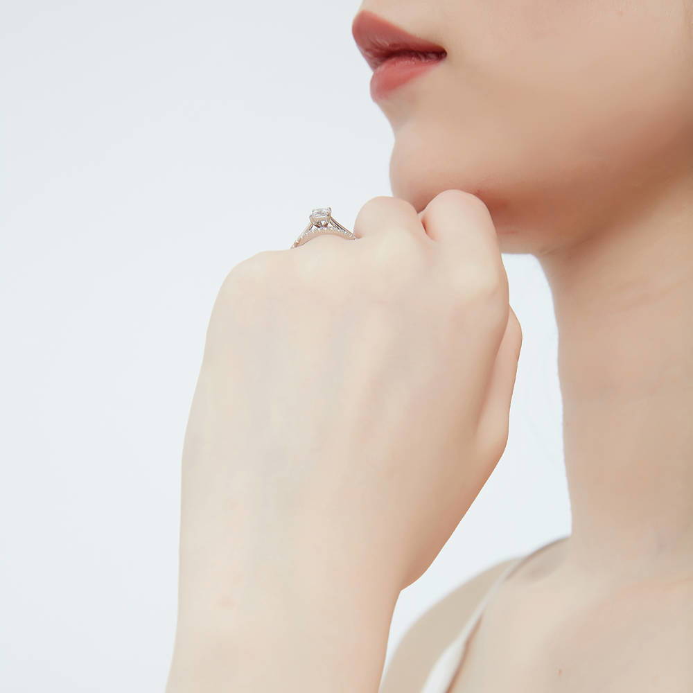 Model wearing Solitaire 0.4ct Princess CZ Ring in Sterling Silver, 9 of 14